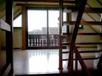 Wohn-/Essbereich mit Zugang zum Balkon